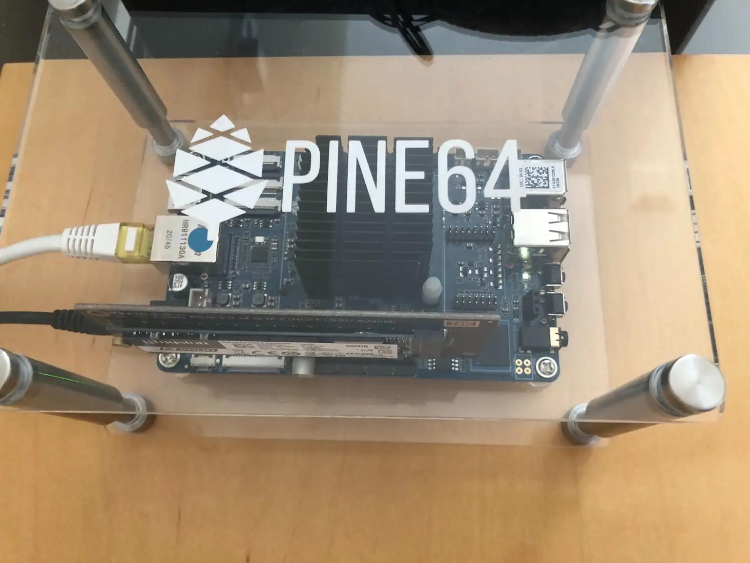 A RockPro64 with a passive heatsink and a Kingston A2000 SSD in an acrylic case